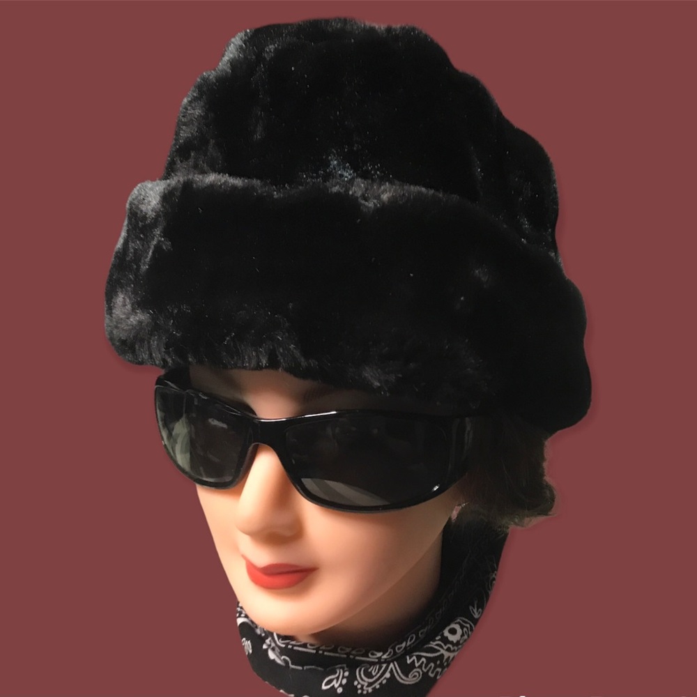 Faux fur Russian style winter trapper hat with retractable padded ear flaps.